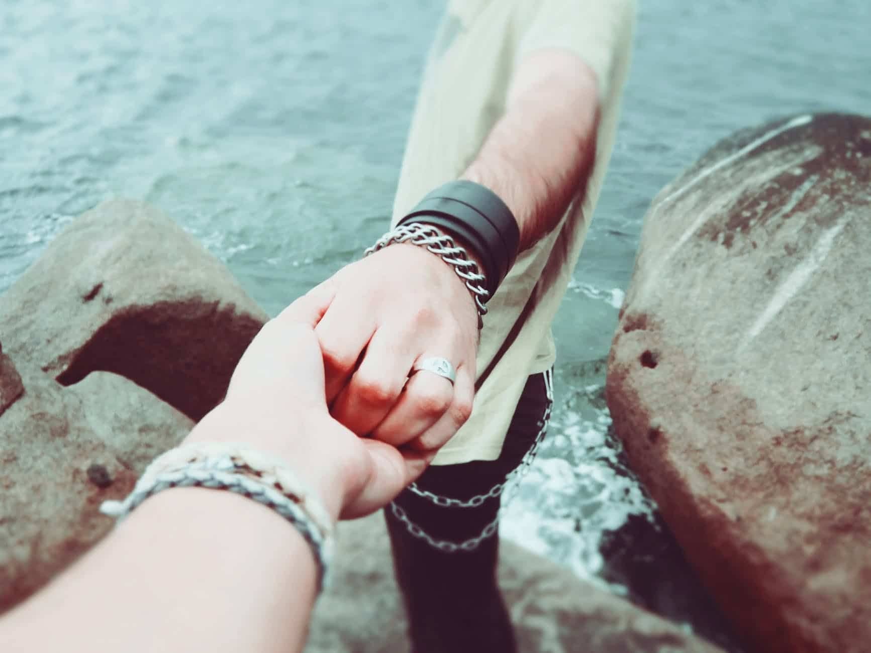 couple holding hands love people
